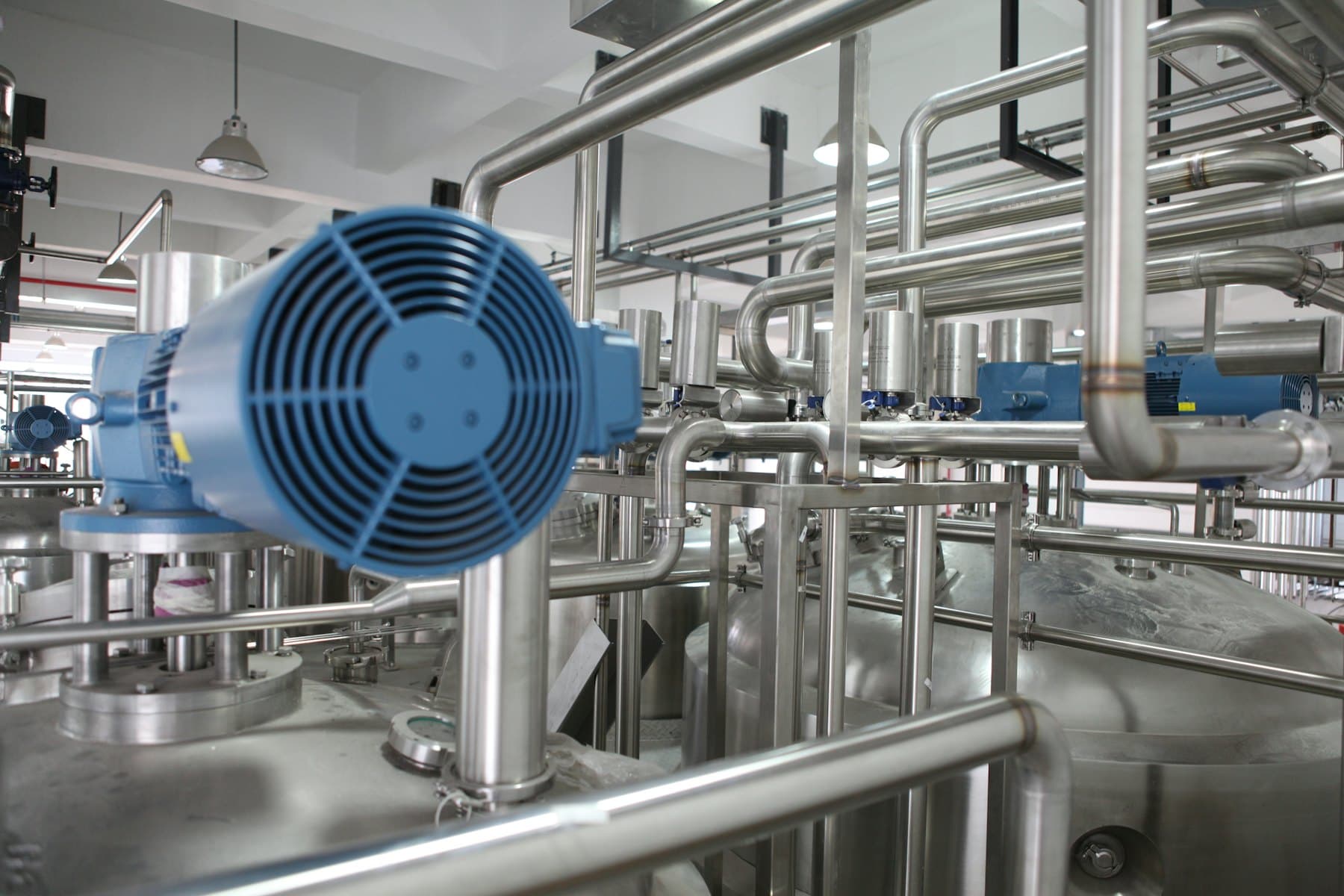 Process pipework and a motor in a refrigeration plant room